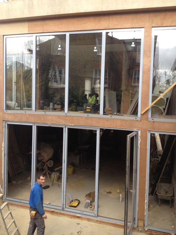 Aluminium bi-fold doors with two-storey glazing in Hayes