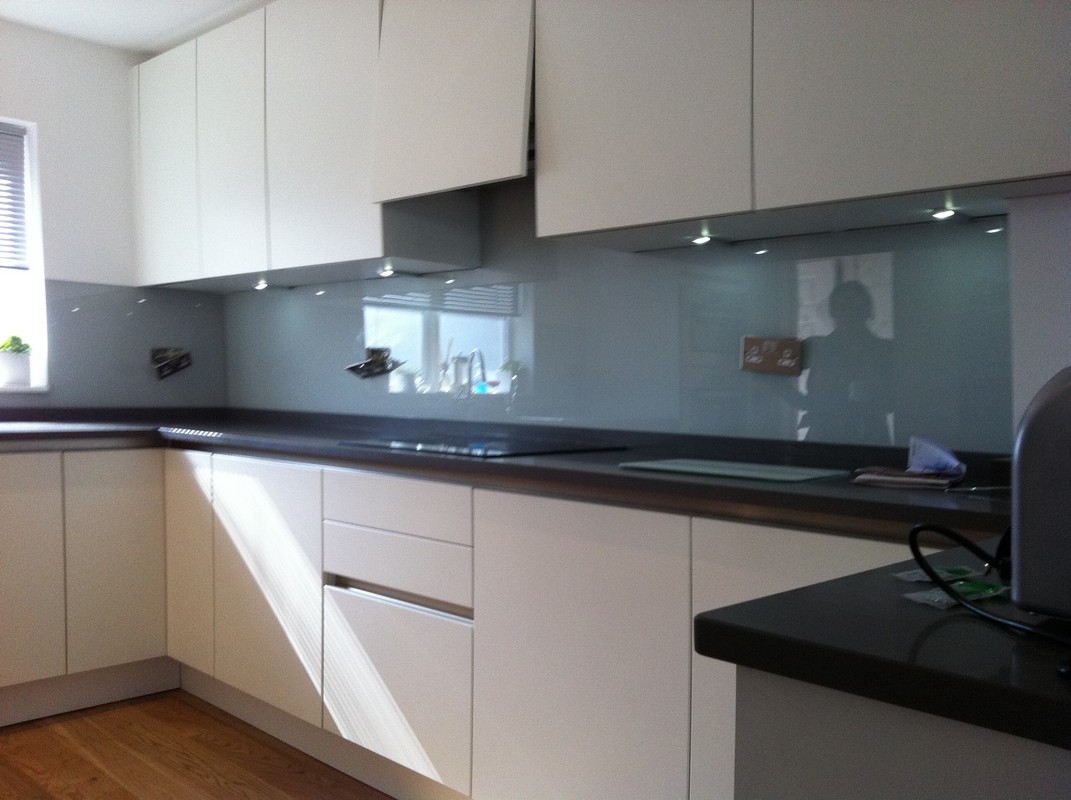 Grey glass kitchen splashback with LED lighting in Hayes