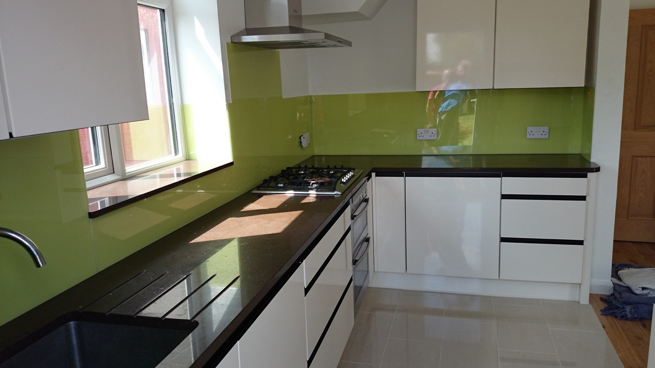 Lime green glass kitchen splashback installed by Hayes glaziers